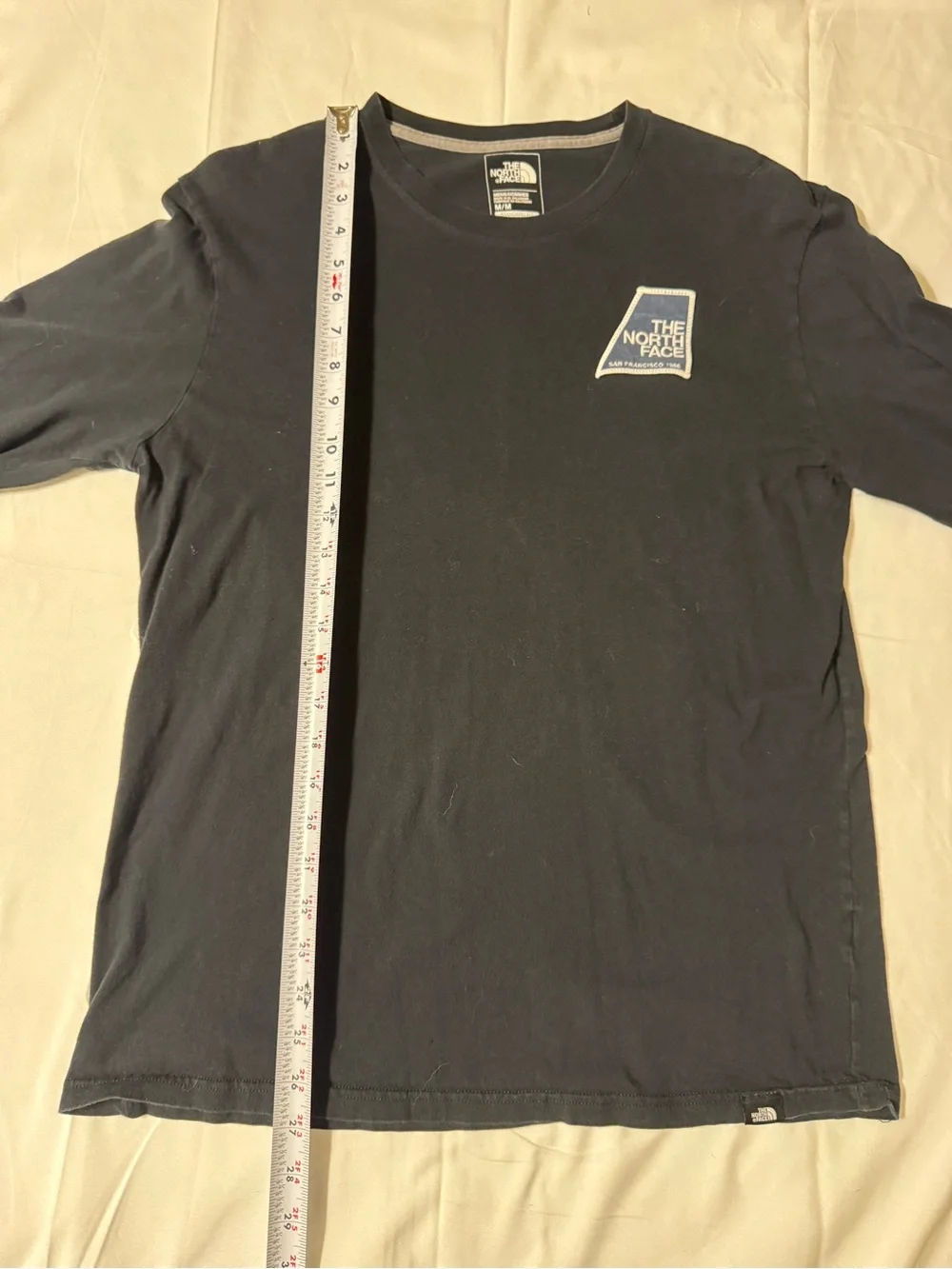 The North Face Black Long Sleeve Tee with Blue Logo Patch